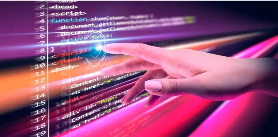Ręka dotykająca kolorowe linie kodu na tle symbolizującym nowoczesną technologię i programowanie, ilustrująca temat ES6 i TypeScript: jak wykorzystać najnowsze funkcje języka JavaScript.